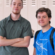 Loser Chris Payack gives his younger counterpart a tour of the math wing during their shared free period.
